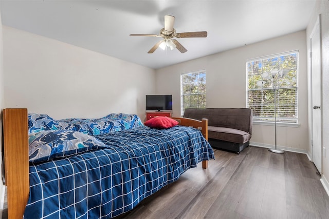 9501 Fondren Rd Unit 9, Houston, TX 77074 - bedroom featuring wood finished floors, baseboards, and ceiling fan