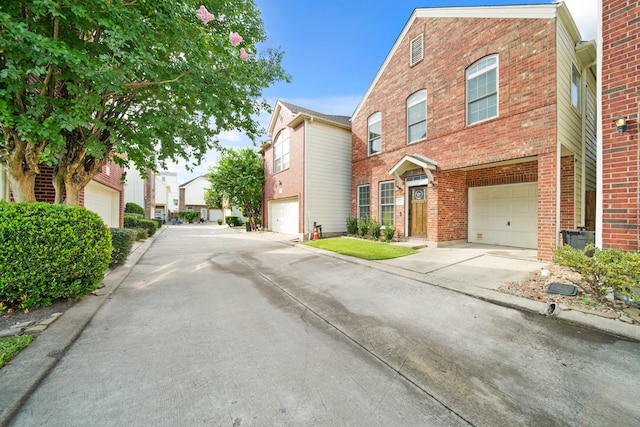 1773 Aden Dr, Houston, TX 77003 - view of front facade featuring brick siding, an attached garage, and concrete driveway