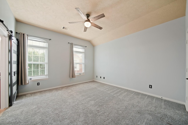 1773 Aden Dr, Houston, TX 77003 - unfurnished room featuring a ceiling fan, carpet flooring, baseboards, a textured ceiling, and vaulted ceiling