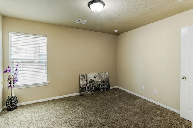 2039 Wembley Way, Rosenberg, TX 77471 - carpeted spare room with plenty of natural light, baseboards, and a textured ceiling