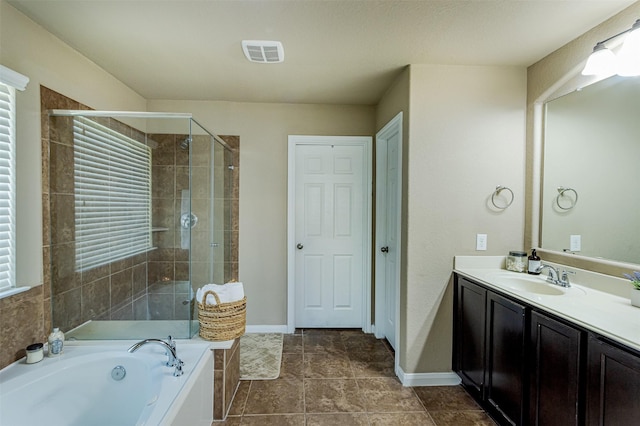 2039 Wembley Way, Rosenberg, TX 77471 - full bathroom featuring vanity, a shower stall, a bath, and baseboards