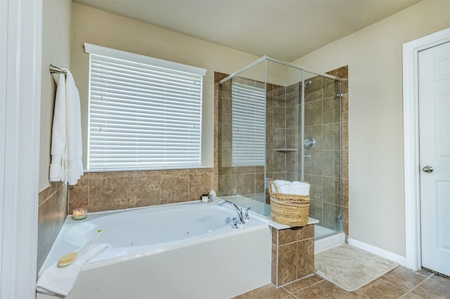 2039 Wembley Way, Rosenberg, TX 77471 - bathroom featuring a stall shower, a tub with jets, and tile patterned flooring