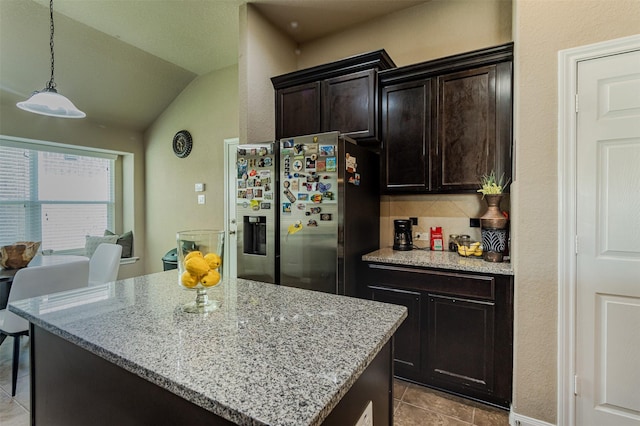 2039 Wembley Way, Rosenberg, TX 77471 - kitchen with stainless steel refrigerator with ice dispenser, light tile patterned flooring, tasteful backsplash, vaulted ceiling, and light stone counters