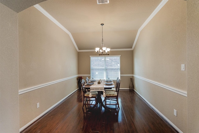 2039 Wembley Way, Rosenberg, TX 77471 - dining space with ornamental molding, wood finished floors, lofted ceiling, a chandelier, and baseboards