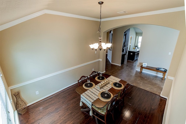 2039 Wembley Way, Rosenberg, TX 77471 - dining area with arched walkways, baseboards, ornamental molding, a chandelier, and dark wood finished floors