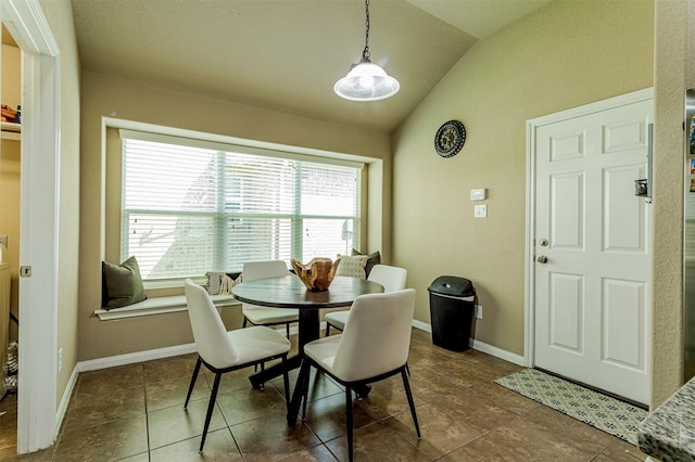 2039 Wembley Way, Rosenberg, TX 77471 - dining area with vaulted ceiling, tile patterned flooring, and baseboards