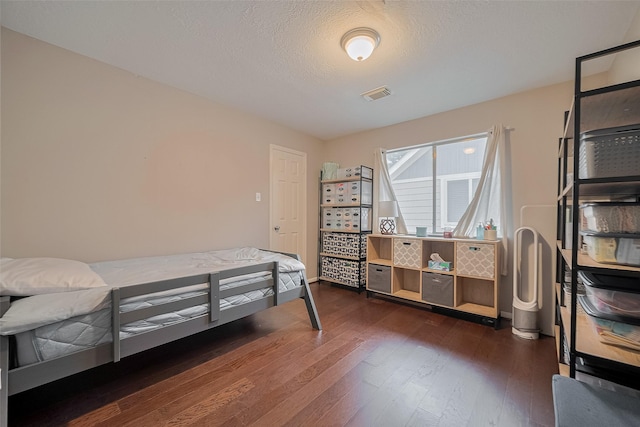 21415 Park Timbers Ln, Katy, TX 77450 - bedroom with dark wood-style flooring