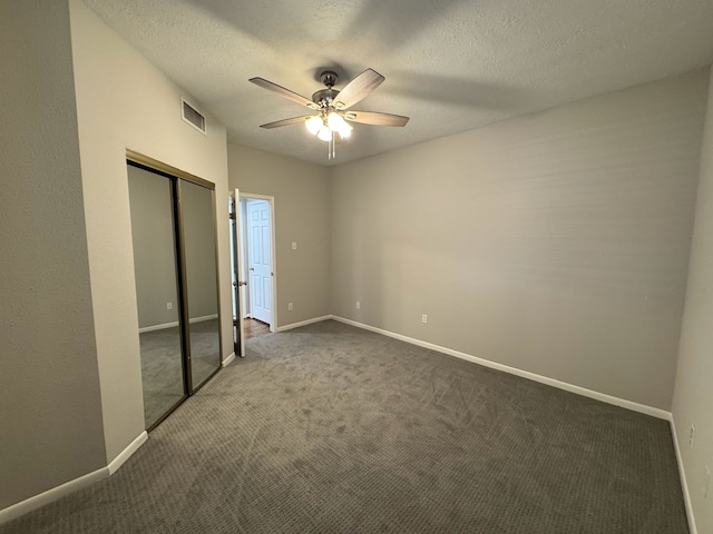 2011 Spenwick Dr Unit 513, Houston, TX 77055 - unfurnished bedroom featuring carpet flooring, baseboards, and a textured ceiling