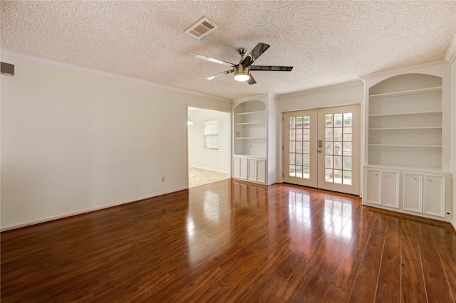 14171 Misty Meadow Ln, Houston, TX 77079 - unfurnished room featuring built in shelves, wood finished floors, french doors, ceiling fan, and crown molding