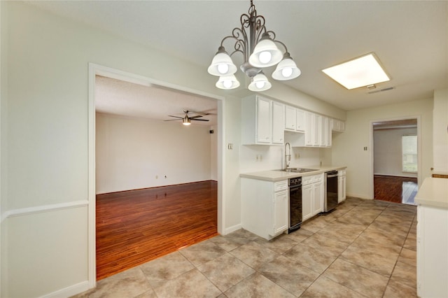 14171 Misty Meadow Ln, Houston, TX 77079 - kitchen featuring dishwasher, light countertops, a sink, and white cabinetry