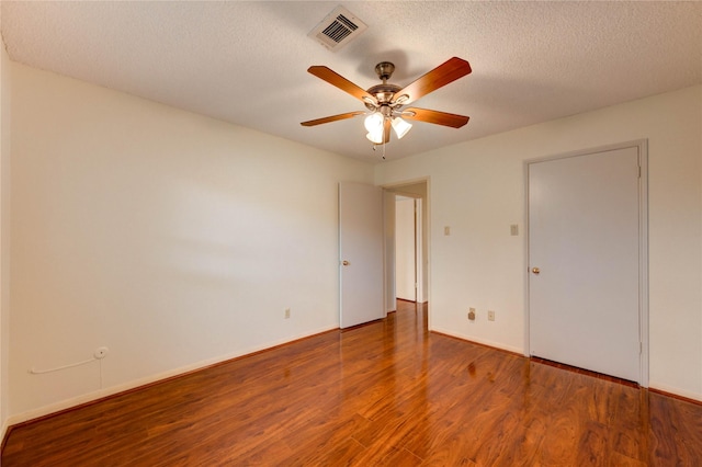 14171 Misty Meadow Ln, Houston, TX 77079 - unfurnished bedroom featuring wood finished floors, baseboards, a textured ceiling, and ceiling fan