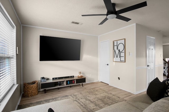 12250 Beamer Rd, Houston, TX 77089 - living room with wood finished floors, ceiling fan, ornamental molding, and baseboards