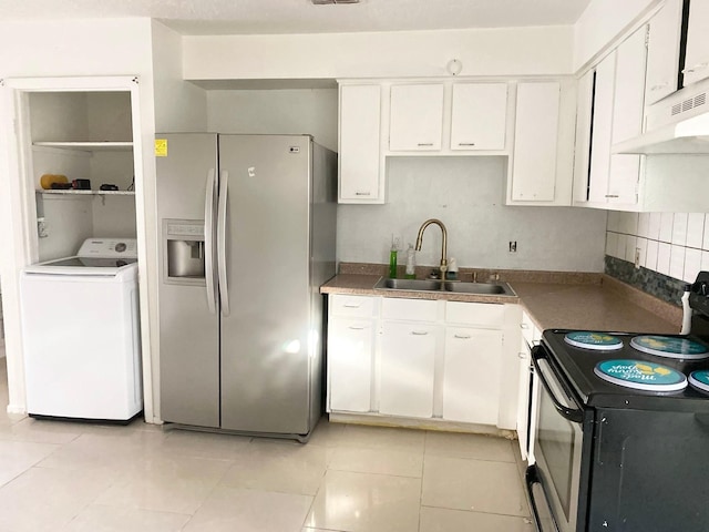 7449 Cook Rd, Houston, TX 77072 - kitchen featuring washer / clothes dryer, stainless steel fridge, electric stove, a sink, and white cabinets