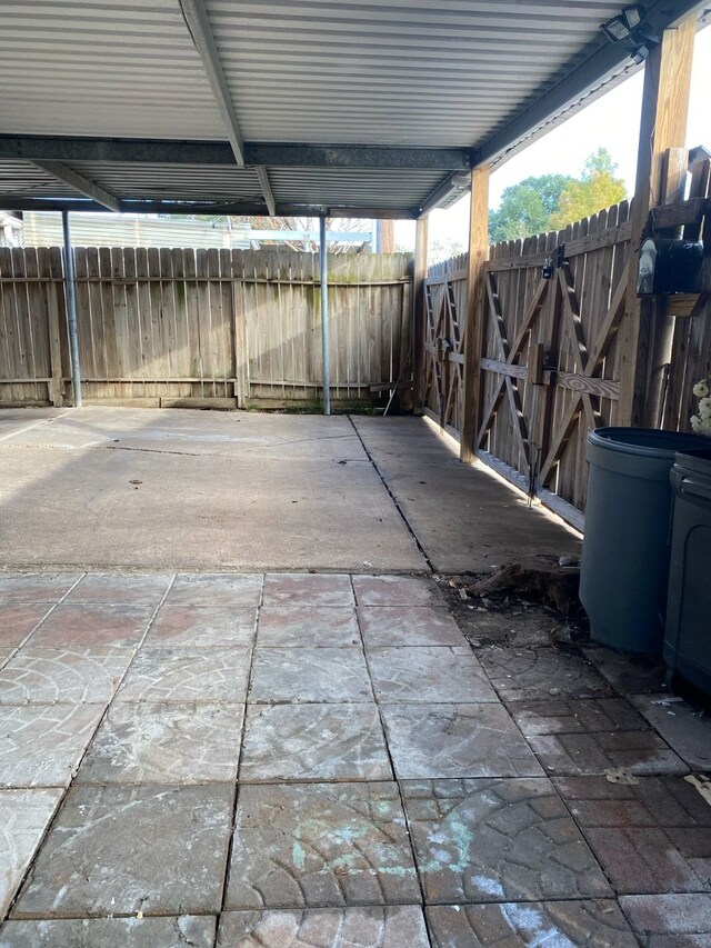 7449 Cook Rd, Houston, TX 77072 - view of patio / terrace featuring a gate and a carport