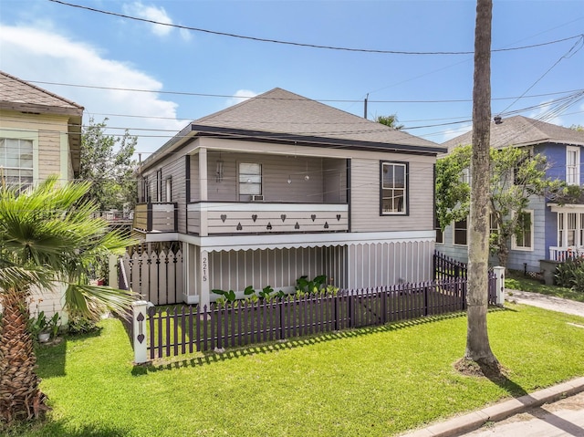 2215 30th St, Galveston, TX 77550 - view of front facade featuring a balcony and a shingled roof