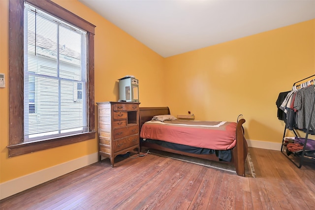 2215 30th St, Galveston, TX 77550 - bedroom with wood-type flooring and baseboards