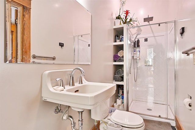 2215 30th St, Galveston, TX 77550 - full bath with a stall shower, toilet, and a sink