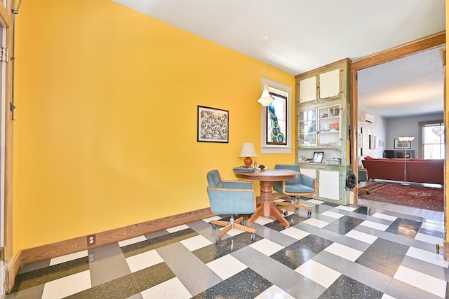 2215 30th St, Galveston, TX 77550 - living area with tile patterned floors, an office area, and baseboards
