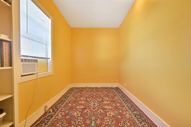 2215 30th St, Galveston, TX 77550 - spare room with baseboards and cooling unit