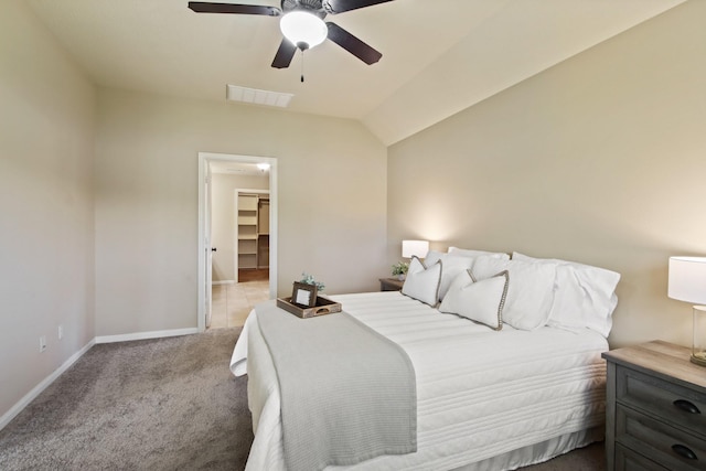 9115 E Lakeside Dr, Magnolia, TX 77354 - bedroom with light colored carpet, baseboards, a spacious closet, a ceiling fan, and lofted ceiling