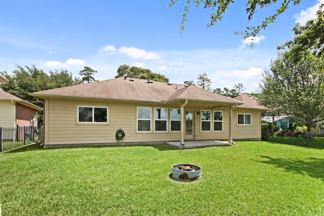 9115 E Lakeside Dr, Magnolia, TX 77354 - back of house featuring a patio and an outdoor fire pit