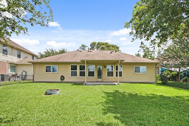9115 E Lakeside Dr, Magnolia, TX 77354 - rear view of property featuring a fire pit
