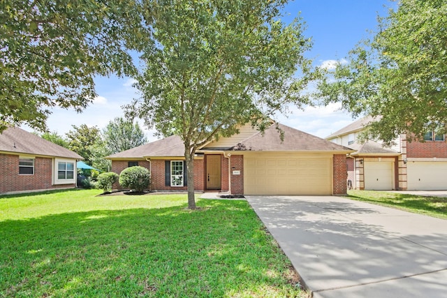 9115 E Lakeside Dr, Magnolia, TX 77354 - ranch-style home with an attached garage, concrete driveway, a front lawn, and brick siding