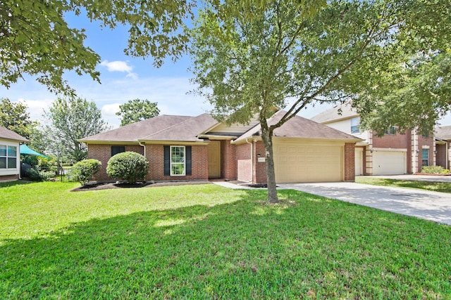 9115 E Lakeside Dr, Magnolia, TX 77354 - view of front of property featuring an attached garage, driveway, a front lawn, and brick siding