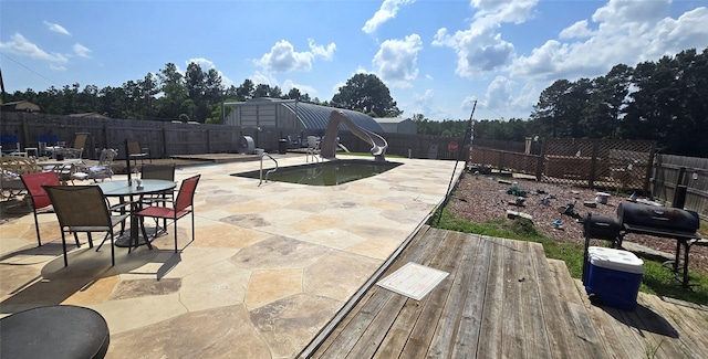1560 Fm 355, Groveton, TX 75845 - fenced backyard with a patio area and area for grilling