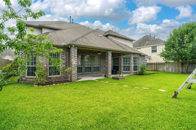 2106 Asbury Ct, Pearland, TX 77581 - rear view of house with brick siding, a patio area, and roof with shingles