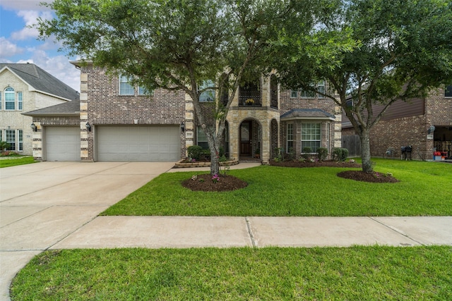2106 Asbury Ct, Pearland, TX 77581 - view of front of property with driveway, a front lawn, an attached garage, and brick siding