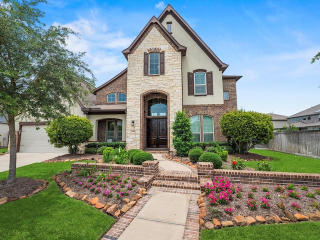 18910 Paddlefish Way, Cypress, TX 77433 - french provincial home featuring stucco siding, concrete driveway, and stone siding