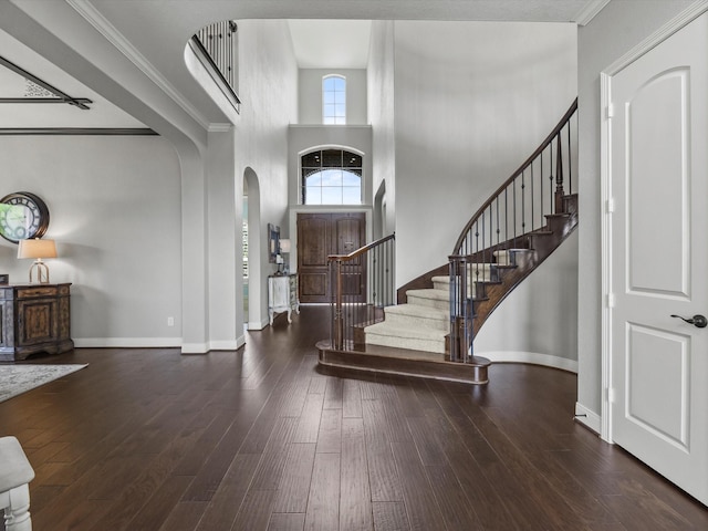 18910 Paddlefish Way, Cypress, TX 77433 - foyer entrance with arched walkways, stairs, wood-type flooring, crown molding, and a high ceiling