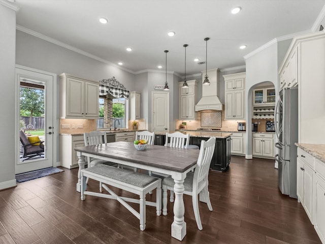 18910 Paddlefish Way, Cypress, TX 77433 - dining space with dark wood finished floors, recessed lighting, and ornamental molding