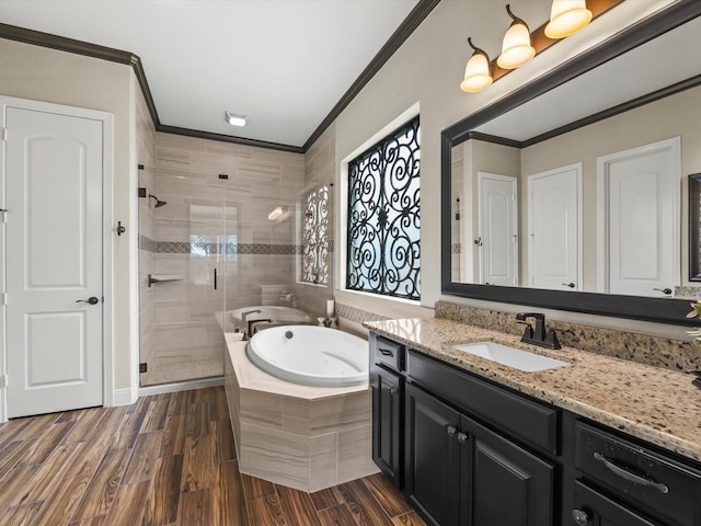 18910 Paddlefish Way, Cypress, TX 77433 - full bathroom with crown molding, vanity, a stall shower, a whirlpool tub, and wood finished floors