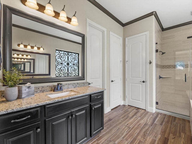 18910 Paddlefish Way, Cypress, TX 77433 - bathroom with crown molding, vanity, a stall shower, and wood finished floors