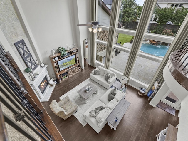 18910 Paddlefish Way, Cypress, TX 77433 - living room with a glass covered fireplace and dark wood-type flooring