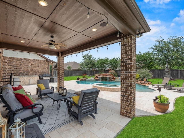 18910 Paddlefish Way, Cypress, TX 77433 - fenced backyard featuring ceiling fan, an in-ground hot tub, a patio area, and area for grilling
