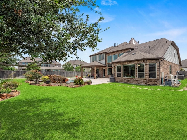 18910 Paddlefish Way, Cypress, TX 77433 - rear view of property with a patio, brick siding, and a fenced backyard