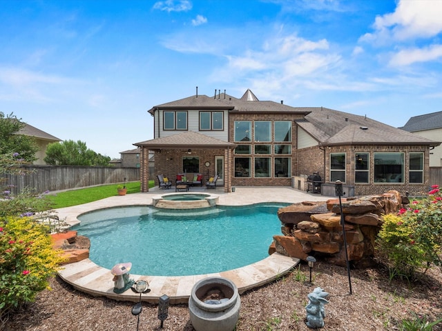 18910 Paddlefish Way, Cypress, TX 77433 - view of swimming pool with a patio, a fenced backyard, a pool with connected hot tub, and grilling area