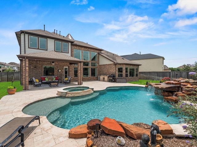 18910 Paddlefish Way, Cypress, TX 77433 - view of swimming pool with a patio area, a fenced backyard, a pool with connected hot tub, area for grilling, and an outdoor living space with a fire pit