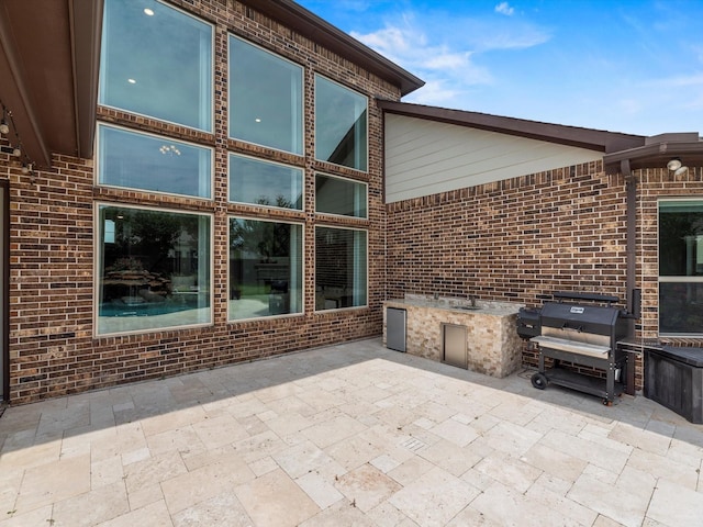 18910 Paddlefish Way, Cypress, TX 77433 - view of patio featuring exterior kitchen
