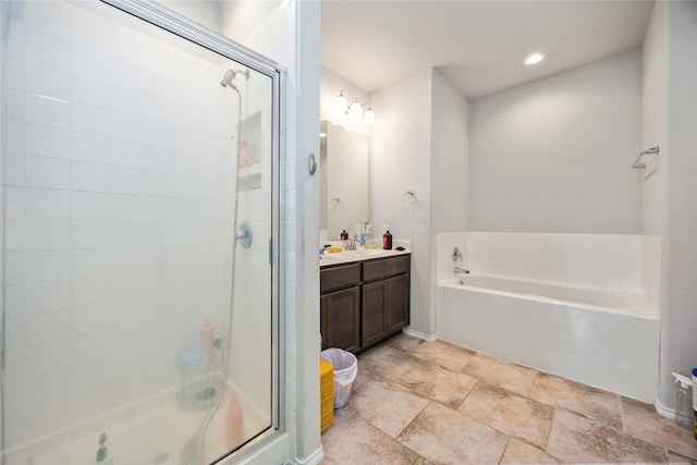 4507 Terrazza Verde Dr, Katy, TX 77493 - full bath featuring a bath, vanity, a stall shower, recessed lighting, and baseboards