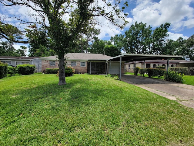 7240 Parker Rd, Houston, TX 77016 - ranch-style house with an attached garage, concrete driveway, brick siding, a front lawn, and a carport