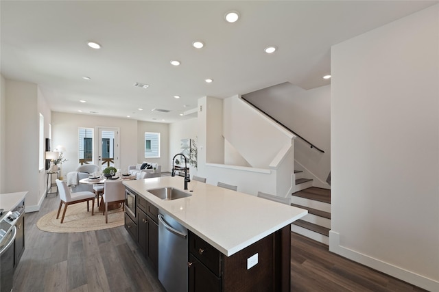 3905 Pinemont Dr Unit G, Houston, TX 77018 - kitchen with a sink, appliances with stainless steel finishes, dark wood-style floors, light countertops, and recessed lighting