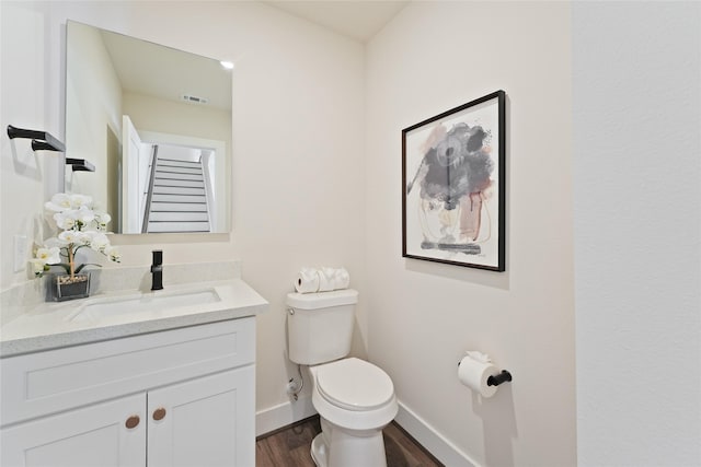 3905 Pinemont Dr Unit G, Houston, TX 77018 - bathroom featuring toilet, vanity, wood finished floors, and baseboards