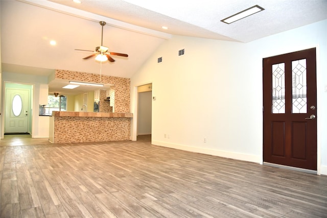 13407 Linden St, Sugar Land, TX 77498 - unfurnished living room with light wood finished floors, baseboards, and ceiling fan