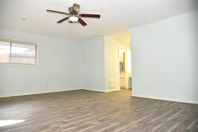 13407 Linden St, Sugar Land, TX 77498 - spare room featuring wood finished floors, a ceiling fan, a textured ceiling, and baseboards