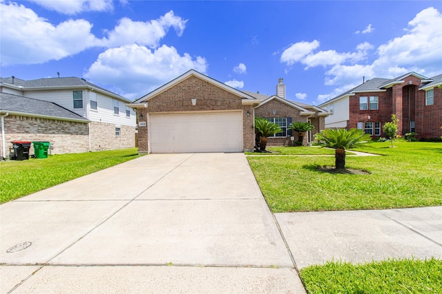 4919 Bentonite Blvd, Baytown, TX 77521 - view of front of property featuring brick siding, a garage, a front lawn, and concrete driveway