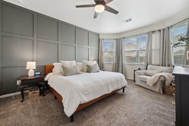 2037 Muggy Ln, Conroe, TX 77301 - bedroom with a decorative wall, multiple windows, carpet floors, ceiling fan, and baseboards